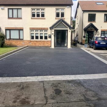 Tarmac Driveway with Silver Granite Border and Connemara Walling in…